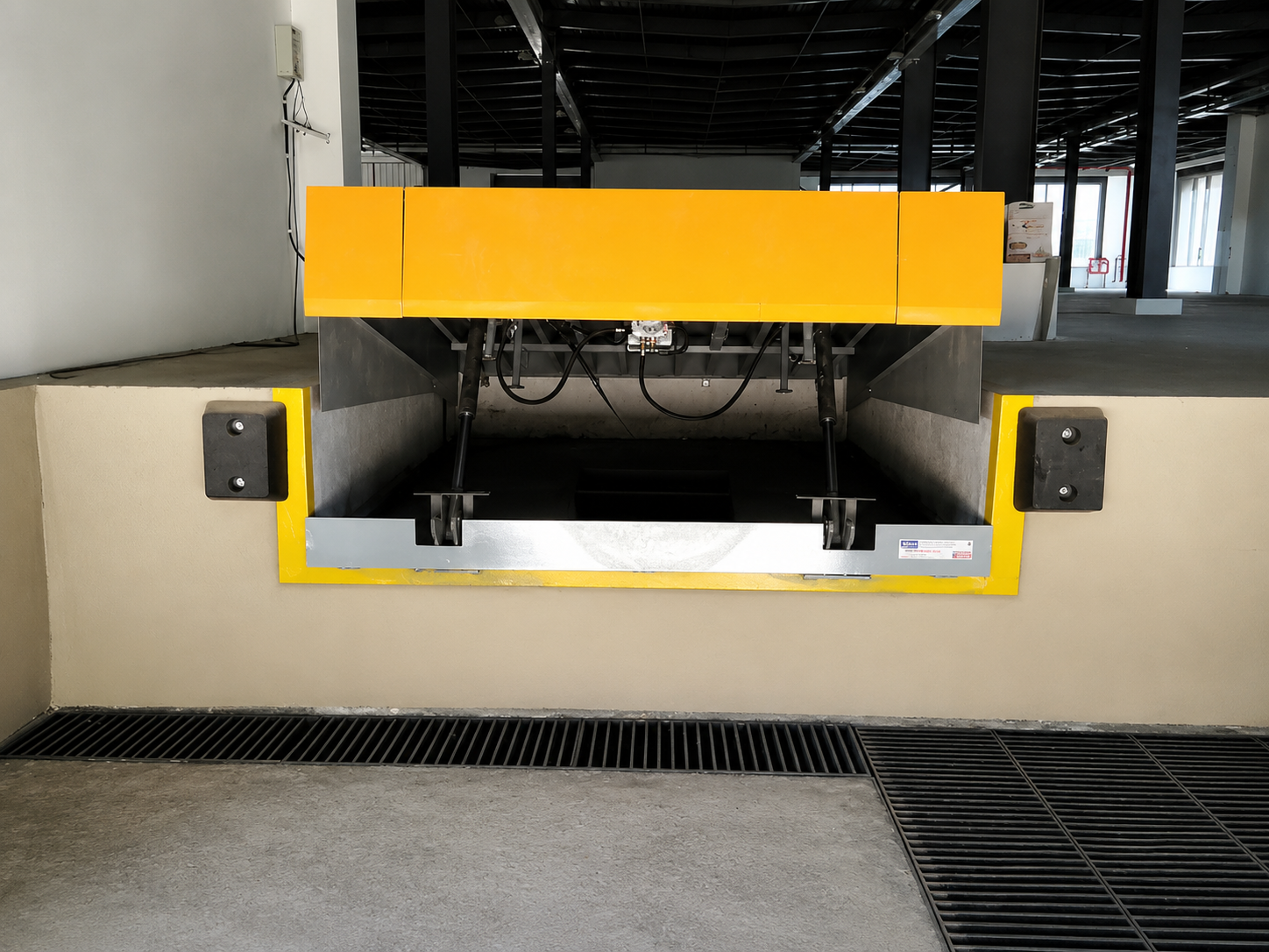 Dock leveler guide rail, bottom rail, and locking mechanism detail